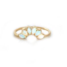 an opal ring with three petals on it