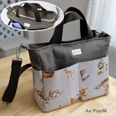 a bag with cats on it sitting on top of a table next to a plate