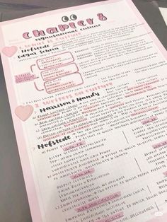 a pink and white menu with writing on it