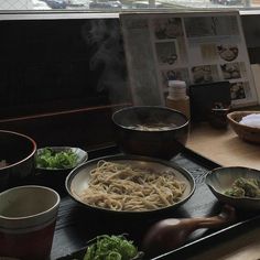 some food is sitting on a tray in front of a window