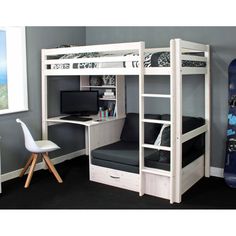 a bunk bed with desk underneath it and a snowboard on the wall next to it