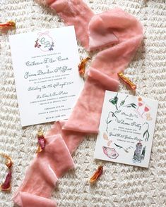 the wedding stationery is laid out on the table