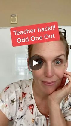 a woman holding up a red sign with the words teacher jack odd one out