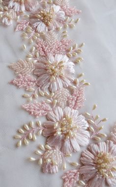 pink and white flowers with pearls on the bottom are shown in this embroidery work pattern