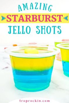 two cups filled with blue and yellow jello shots