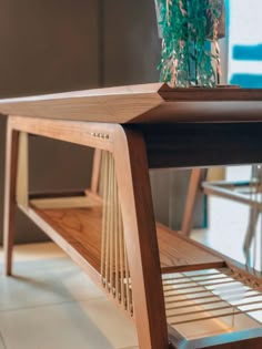 a wooden table with a plant on top