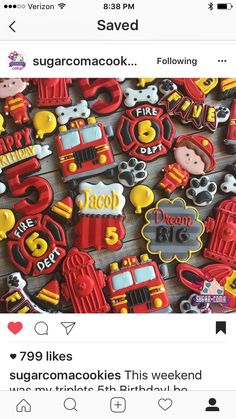 decorated cookies with firetrucks, trucks and numbers are on a wooden table