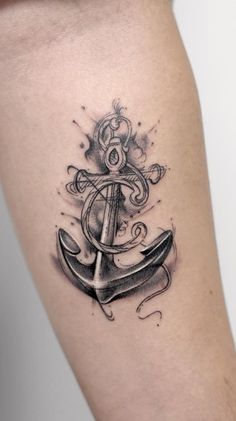 an anchor tattoo on the thigh