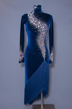 a blue dress with sequins and fringe on it