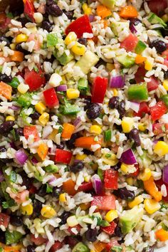 a bowl filled with rice, beans, and veggies on top of a table