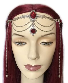 This gothic vampire inspired headpiece is made with a large antiqued silver plated bat, filigree beads, findings and draping chains. It is accented with sparkling DARK RUBY RED glass rhinestones/jewels. Centerpiece is worn with silver plated cable chain. Decorated portion is 6 3/4" wide and 2 1/2" tall in the center. Side hanging strands are 6 1/2" in length. Headpiece is adjustable 21-24" with a lobster clasp and chain extender in the back. If you would like a different length or stone color, p Gothic Silver Jewelry For Costume Party, Silver Fantasy Costume Accessories For Fantasy Events, Silver Costume Accessories For Halloween, Silver Costume Accessories For Halloween Fantasy Events, Adjustable Gothic Costume Accessories For Fantasy Events, Silver Gothic Costume Accessories For Cosplay, Silver Gothic Costume Accessories For Costume Party, Silver Fantasy Headpiece For Costume Party, Silver Gothic Headpiece For Party