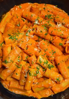 pasta with sauce and parmesan cheese in a skillet