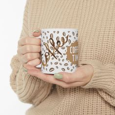 a woman is holding a coffee mug in her hands with the words coffee time printed on it