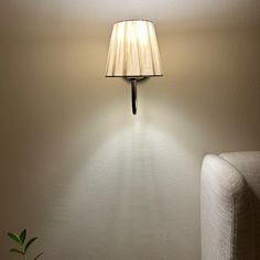 a lamp that is on the side of a wall