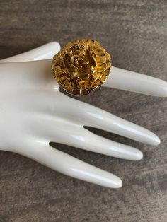 "Flower cocktail ring by Oscar de la Renta.   22K gold plate finish. There is an inner spring clip in the band allowing for adjustment in size from 4.5 to 7.2. Hallmarked \"Oscar de la Renta\"  In excellent previously owned condition. Please view all photos and ask any questions you may have." Elegant Gold Flower Ring For Party, Vintage Adjustable Gold Flower Ring, Adjustable Vintage Gold Flower Ring, Elegant Gold Flower Metal Ring, Adjustable Gold Flower Ring For Formal Occasions, Gold Open Ring Flower Ring For Formal Occasions, Formal Gold Open Flower Ring, Gold Open Ring Flower Design For Formal Occasions, Gold Hallmarked Flower Ring For Anniversary