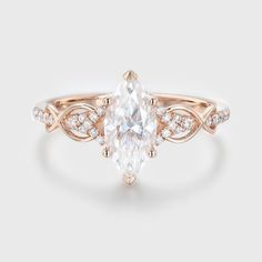 a rose gold ring with an oval cut diamond in the center