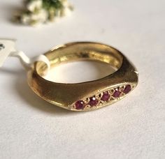 Classic signet ring in a marquise design set with rubies, dainty minimalist vintage style pinky ring jewelry for women, available in 14k gold plating, sterling silver, 9k or 14k solid yellow gold.  This delicate handmade gold ring is elegant and minimalist and has a vintage touch to it. It was made by carving wax and casting it into metal. It is set with 5 small rubies.  It is available in high-quality 14k gold plating,  sterling silver, 9k or 14k solid yellow gold.  This ring is very comfortable to wear and great for everyday use, and will never go out of style. It can also be a great pinky ring. Get this timeless, vintage style signet ring- you'll never want to take it off :).  Item details: 1 sterling silver / 14k gold plated / solid gold ring. Dimensions: Top of the ring: 0.19"x0.62" ( Mejuri Signet Pinky Ring, Gold Pinky Ring For Women, Going Out Top Ring, Luxury Gold Ruby Signet Ring, Wax Carved Ring Signet, Luxury Vintage Ruby Signet Ring, Asymmetrical Gold Ring, Tuby Ring, Stacked Signet Rings