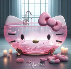 a pink hello kitty bathtub with candles around it and an image of a cat in the tub