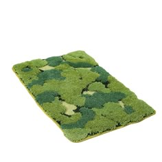 a green rug that has been made to look like broccoli on the ground