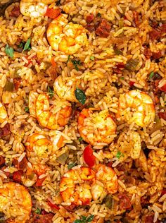 rice with shrimp and tomatoes in a pan