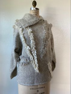 "1980's Fiore Italy Wool/Kid Mohair/Alpaca/Silk Asymmetrical Shawl Collar / Dolman Sleeve / Sweater with Abstract Textured Detailing Label: Fiore Tags:  45% Lana Wool, 30% Kid Mohair, 10% Alpaca, 10% Polyamide, 5% Silk | Made in Italy | Hand Wash, Line Dry Condition: Great (no tears, holes or stains) Specs: - grey and white marled, slub yarn - textured, fuzzy body - grey and white abstract yarn lines running throughout - exaggerated asymmetrical shawl collar - long sleeve, dolman style Measurements: - 21\" armpit to armpit - 23\" nape of neck to hemline - 21\" shoulder seam to shoulder seam - 17\" armpit to cuff - 17\" waist (un-stretched & stretched out laid flat) Content:   Lana Wool, Kid Mohair, Alpaca, Polyamide, Silk Any additional questions, please don't hesitate to message me!" Asymmetrical Shawl, Slub Yarn, Dolman Sleeve Sweater, Nape Of Neck, Shawl Collar, Dolman Sleeve, Sleeve Sweater, Alpaca, Sweater Outfits