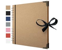 a brown notebook with a black ribbon tied around it