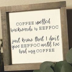 a wooden frame holding a sign that says coffee spelled backwardss to effroc