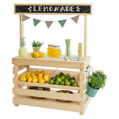 a lemonade stand with fresh fruit and drinks