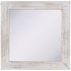 an old white frame mirror on a white wall with wood grained edges and border