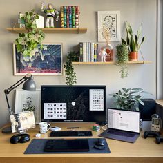 a desk with a laptop, monitor and keyboard on it