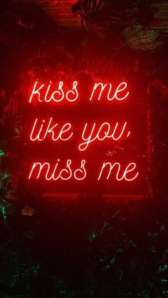 a red neon sign that says kiss me like you miss me