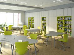 a room with tables, chairs and bookshelves filled with green bookcases