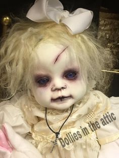 a creepy doll with blonde hair and blue eyes