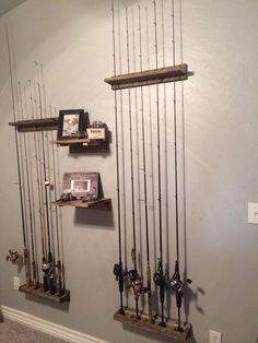 some fishing rods are hanging on the wall