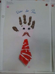 a child's handprint with a tie on it