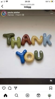 the words thank you are made out of plastic letters in different colors and shapes on a white background