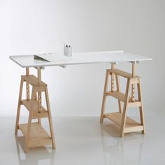 a white desk with two wooden shelves underneath it