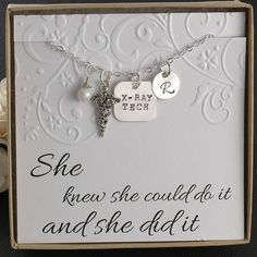 a card with a key and two charms on it that says she knew she could do it and she didn't