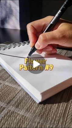 a person writing on a piece of paper with a pen in their hand and the text fliers pattern 9