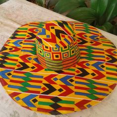 African Print Multicolor Flat Brim Hat For Vacation, Colorful Wide Brim Sun Hat For Vacation, Colorful Curved Brim Sun Hat For Vacation, Fun Yellow Sun Hat With Curved Brim, Colorful Sun Hat For Vacation, Yellow Casual Beach Season Hat, Fun Yellow Festival Hat, Fun Yellow Hat For Festival, Fun Yellow Hat For Festivals