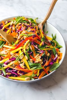 a salad with carrots, red cabbage and peanuts