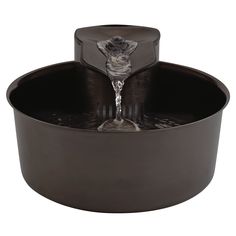 a water fountain in the shape of a bowl with a cat on it's head