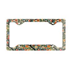 an ornate floral design on a metal license plate frame with black border and white background