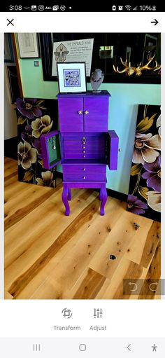 a purple dresser sitting on top of a wooden floor