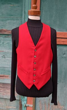 This handsome vest will set off your weekend riding attire so well, with a brilliant flash of bright color and lovely tailoring. Red worsted wool front with acetate lining/back; 6 button front placket, faux cuffed front pockets, deep v-neck, strap/buckle adjustment back, excellent condition. No label or marked size but measures like a 40, c1960s. The following measurements were taken with the garment lying FLAT and recorded in inches, please be sure and DOUBLE the appropriate measurements: Shoul Mens Vests, Vest Outfits, Neck Strap, Western Outfits, Bright Color, Week End, Vintage Men, 1960s, V Neck