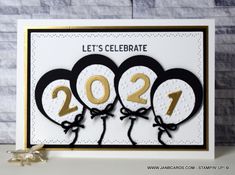 a happy new year card with three penguins in the shape of numbers and bows on it