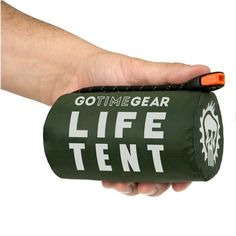 a hand holding a life tent in it's left arm and the words gotimegear on it