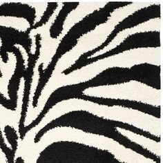 a black and white rug with zebra print