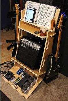 an electronic device is sitting on top of a guitar stand