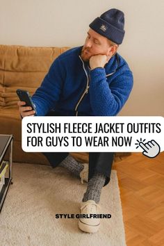 stylish man sitting on a couch wearing a navy beanie, bright blue fleece jacket, dark pants, camp socks, and canvas sneakers. text on-screen reads: stylish fleece jacket outfits for guys to wear now (style girlfriend) Black Fleece Jacket Outfit Men, Black Fleece Jacket Outfit, Fleece Jacket Outfit Men, Fleece Jacket Outfit, Outfits For Guys, Sherpa Cardigan, Sherpa Fleece Jacket, Fleece Outfit